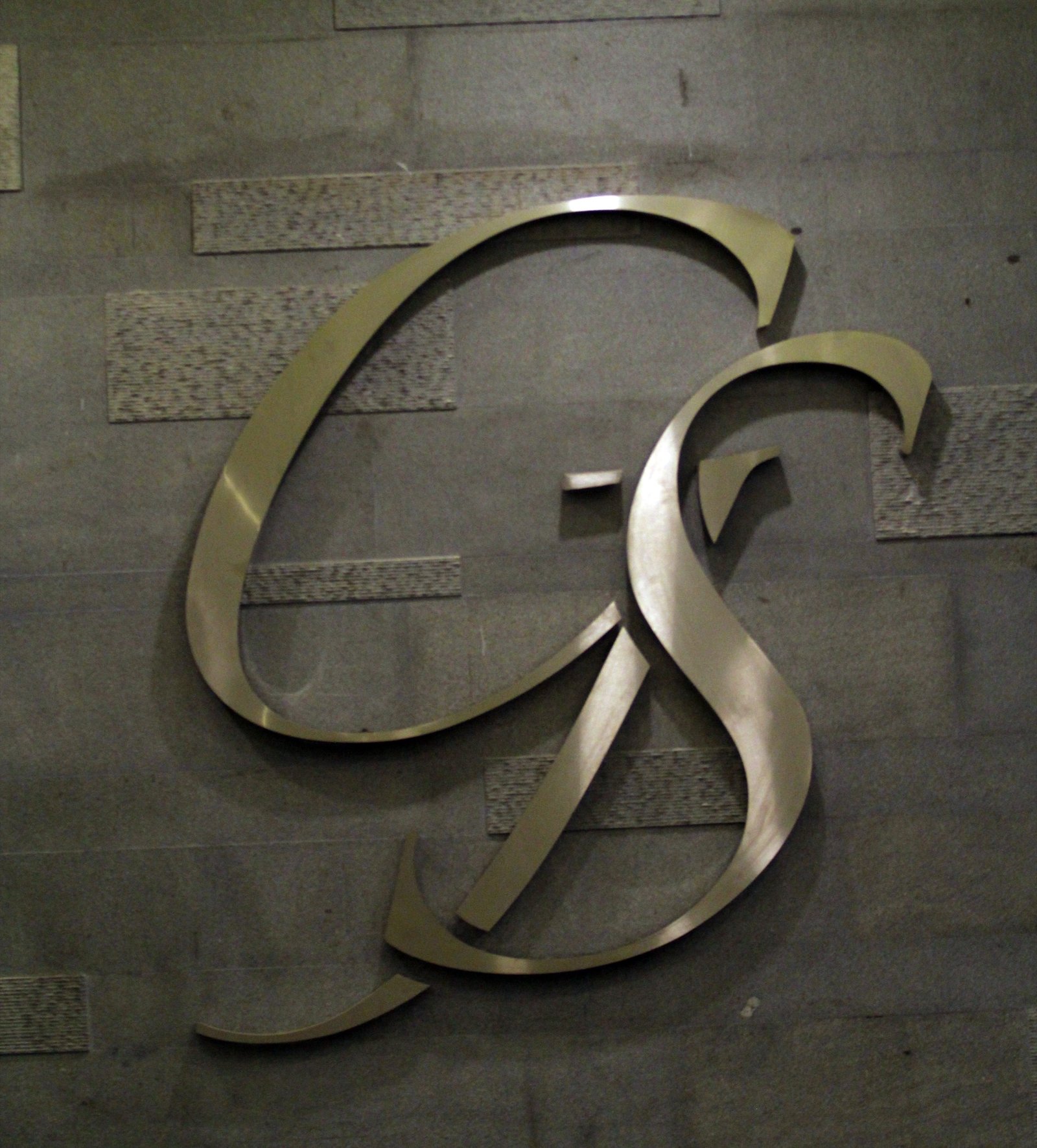 The Grey Suit brass monogram